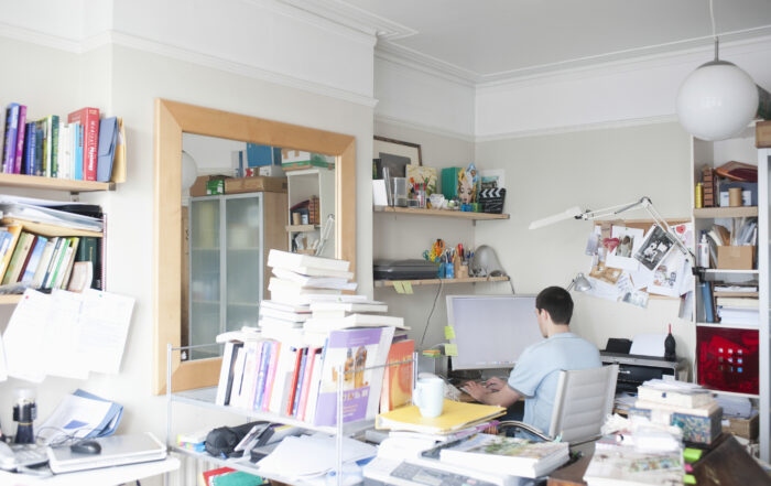 Interstate Home Office Move Adelaide showing a home office setup with desk, computer, books, and work equipment prepared for relocation.